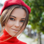 closeup photo of woman wearing red cap