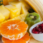 sliced orange fruit on white ceramic bowl