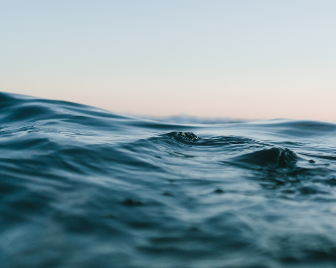 body of water under sky