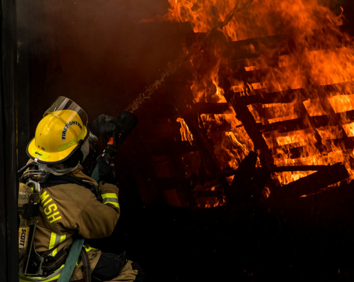 firefighter inside burning house