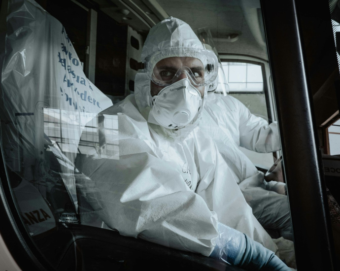 man in white dress shirt wearing white face mask