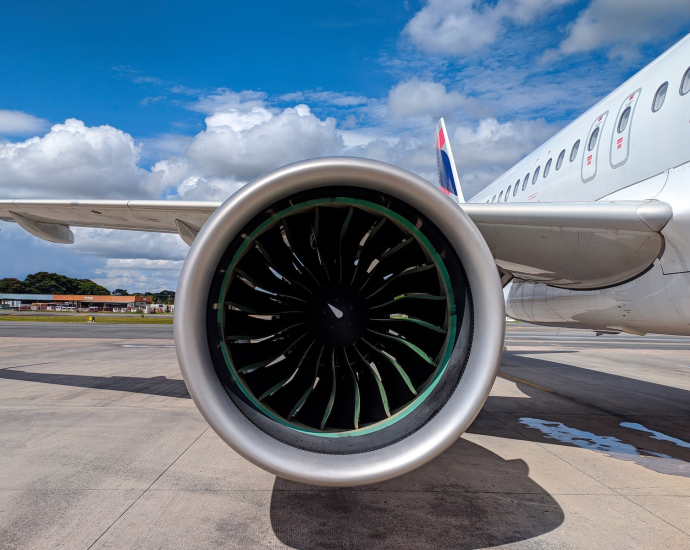 a large jetliner sitting on top of an airport tarmac