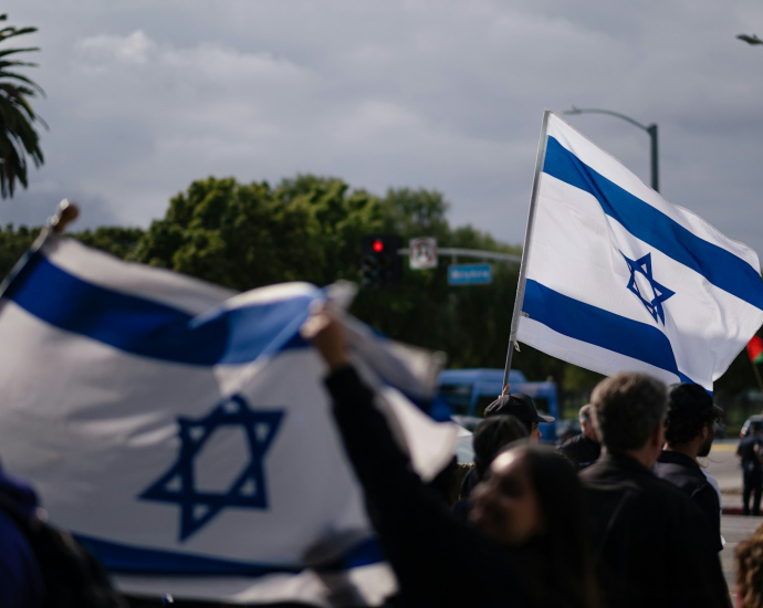 people holding flags during daytime