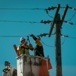 Electricians Fixing the Electric Lines