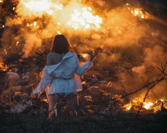 woman wearing white dress shirt standing near ember