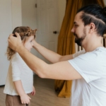 Father Putting Flower Crown to Her Daughter