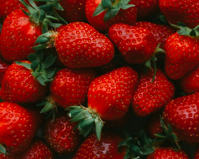 red strawberries on black surface