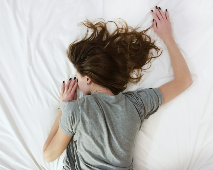 woman laying on bed