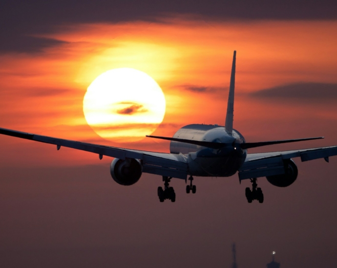 white plane flying during golden hour