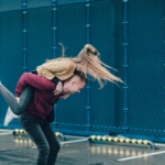 man carrying woman on back