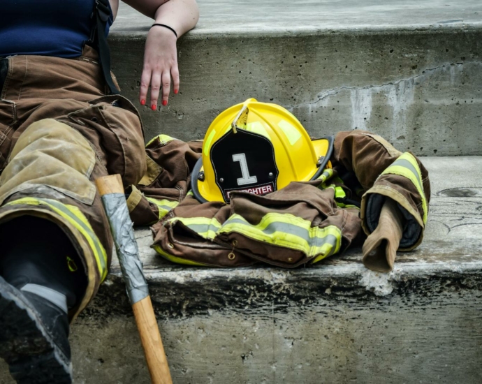 Yellow Hard Hat on Brown and Yellow Fireman's Suit