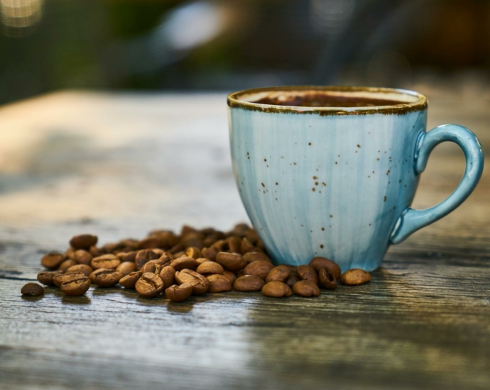 Blue Cup Near Coffee Beans