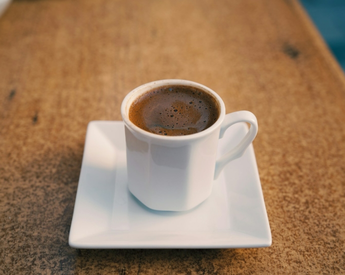 white ceramic mug on white ceramic saucer