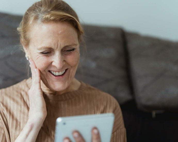 Smiling Woman Using a Tablet