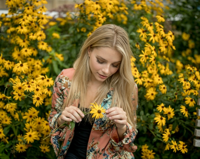 woman holding sunflower