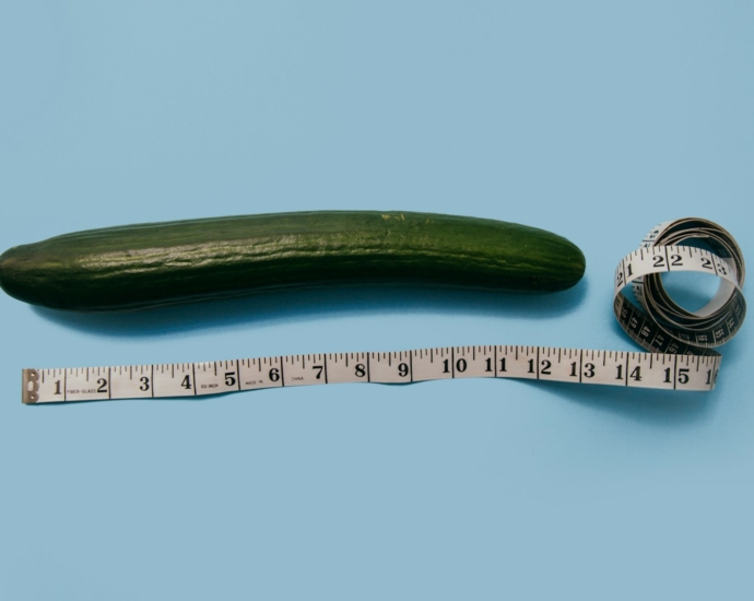 gourd and white tape measure on blue surface