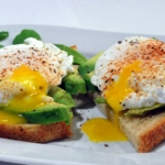 bread with egg and vegetable on white ceramic plate