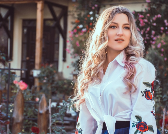 woman standing in front of house