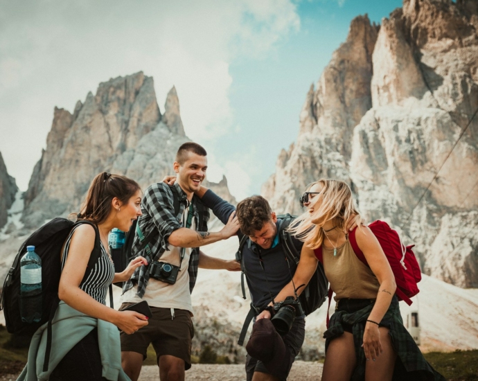 low-angle photography of two men playing beside two women