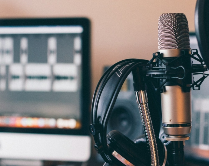 black and silver headphones on black and silver microphone