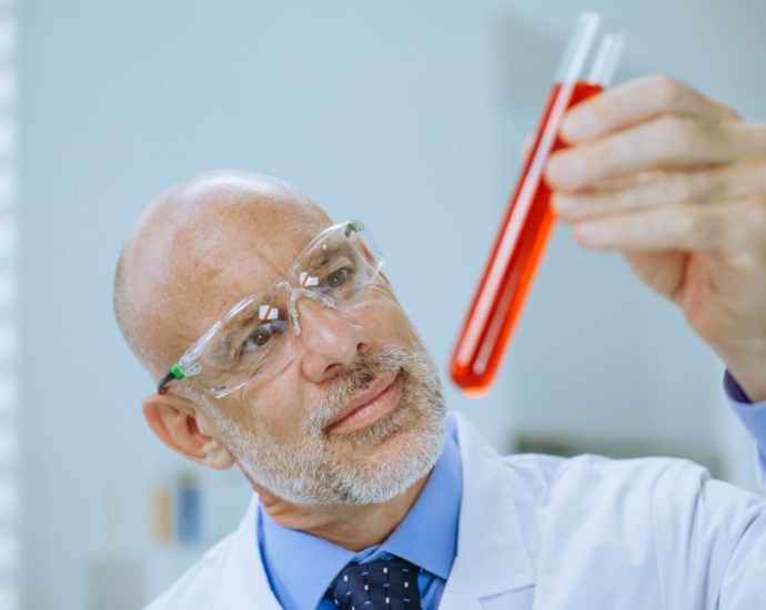 Close-Up Photo of a Man Doing an Experiment