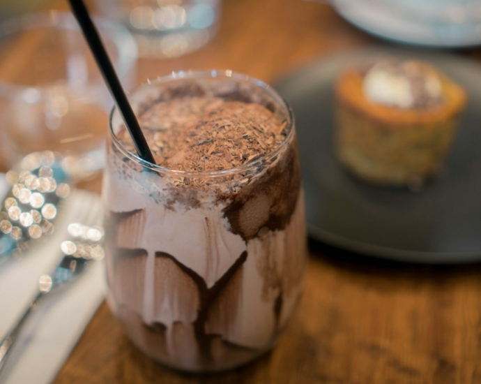 clear glass cup with brown liquid