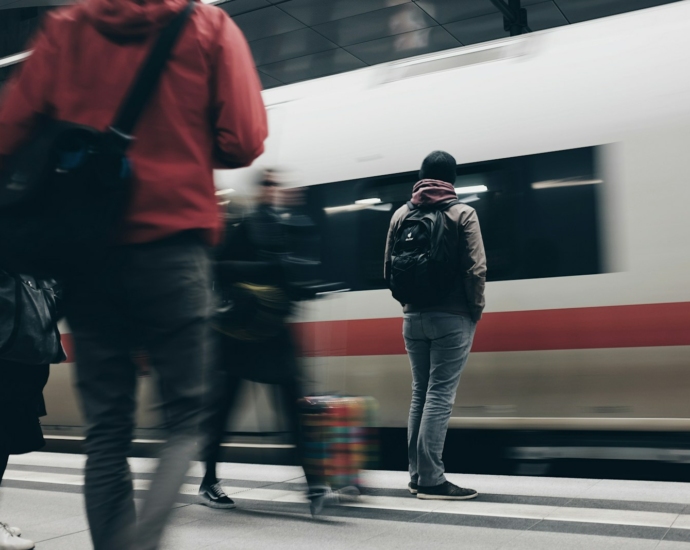 people standing beside train