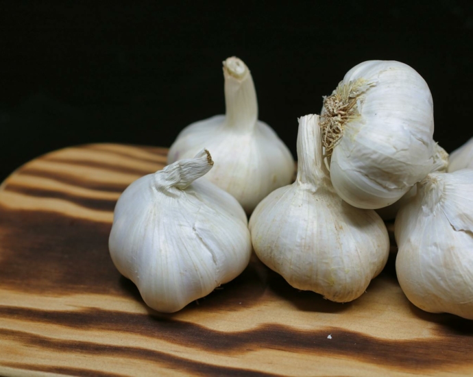 Garlic Bulbs on Brown Surface