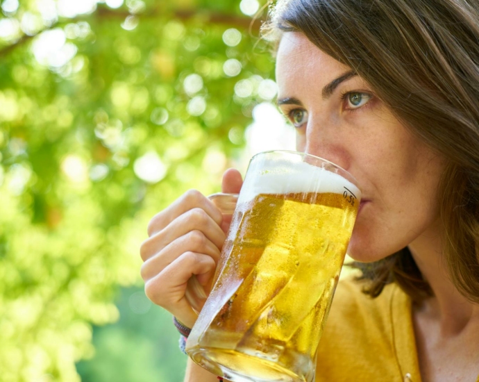 Photo of Woman Drinking Beer