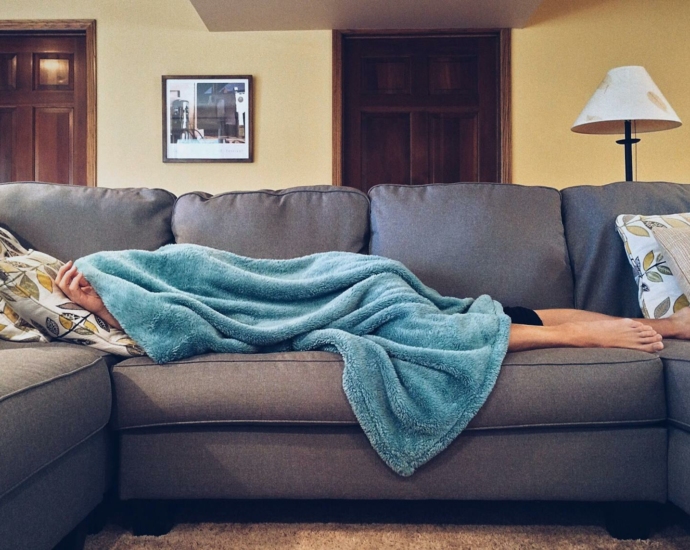 Person Lying on Sofa