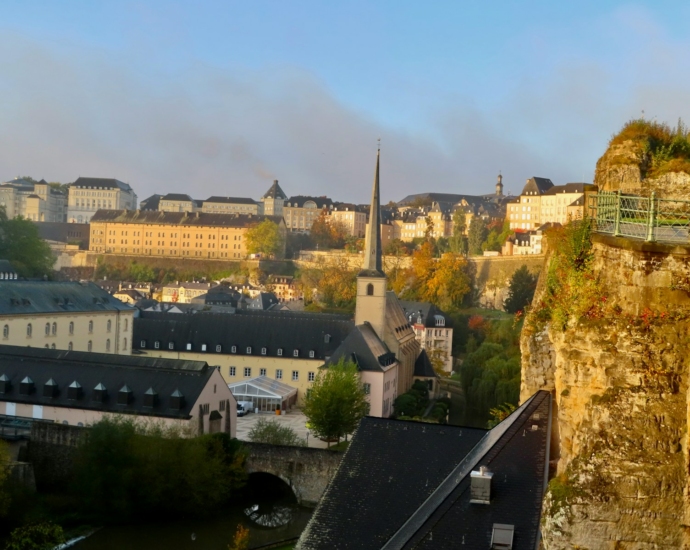 a view of a city from a high cliff