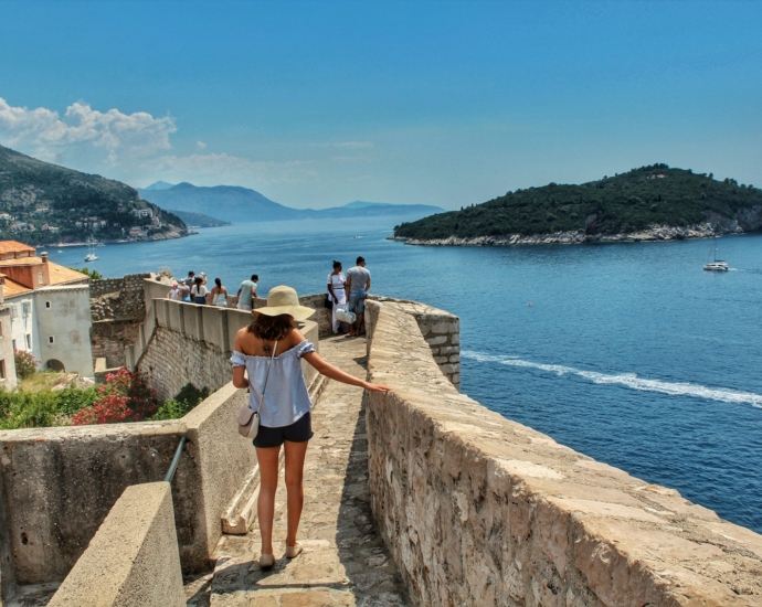 people walking on concrete pathway