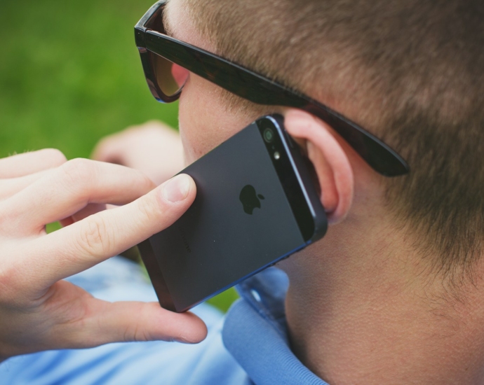 person holding black iPhone 5s