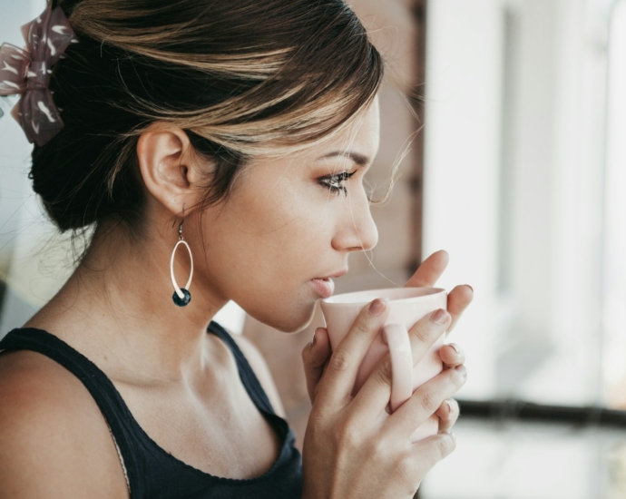 woman drinking cup