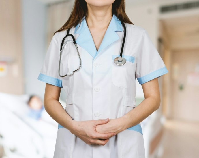 woman in white button up shirt and blue stethoscope