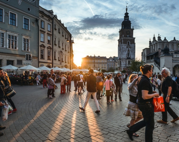 people walking on street near concrete buildings