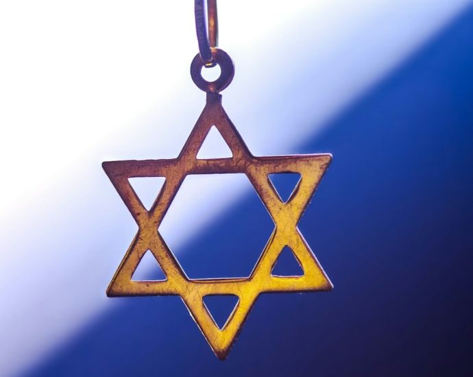 a star of david hanging from a chain