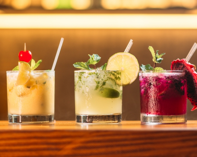 three clear glass cups with juice