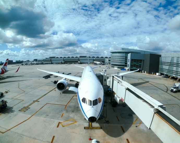 white airplane at airport during daytime