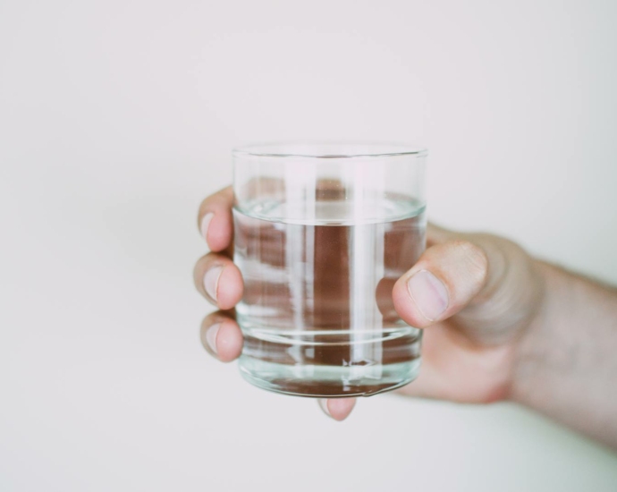 Person Holding Drinking Glass