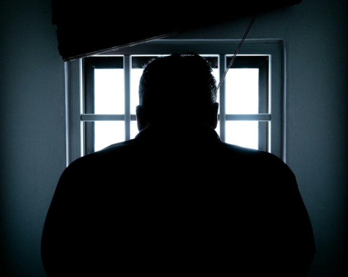 Rear View of a Silhouette Man in Window