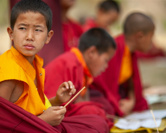 selective focus photography of boy sitting in round