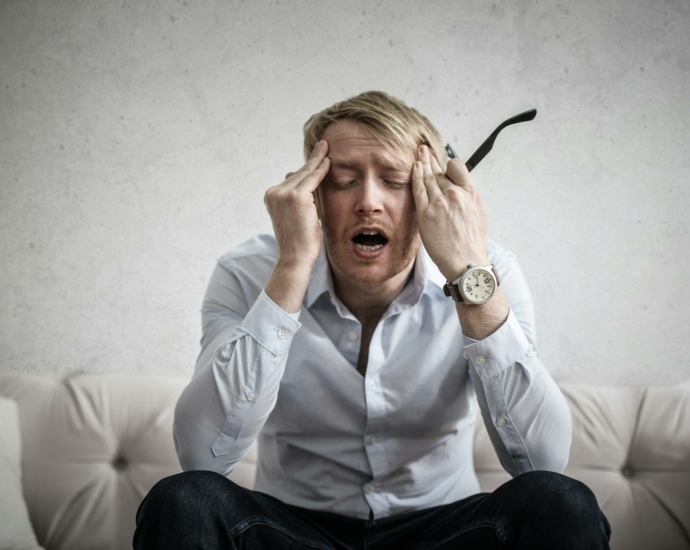 Photo Of Man Touching His Head