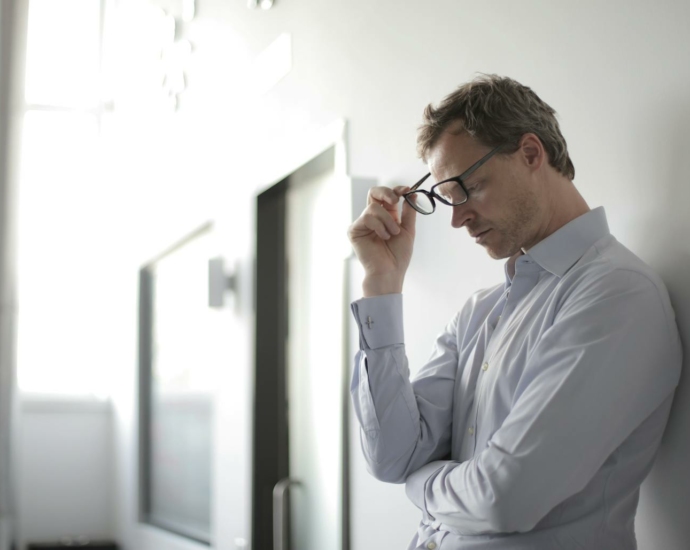 Photo Of Man Holding Black Eyeglasses