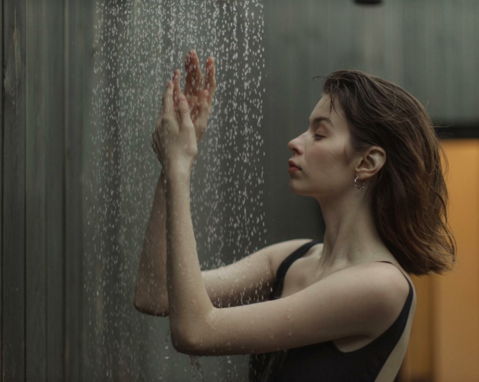 Side View of a Woman Taking a Shower