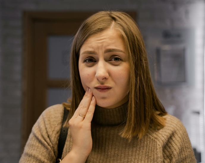 Woman With Hand on Her Cheek