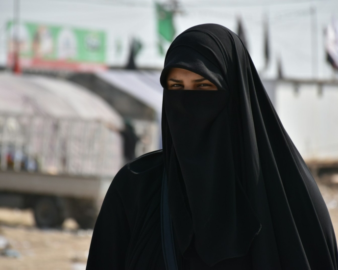 focus photography of women wearing black niqab