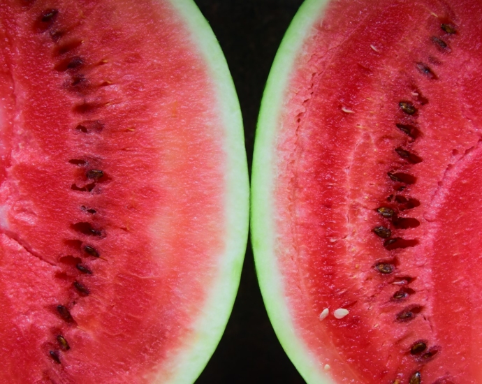 sliced watermelon on black surface