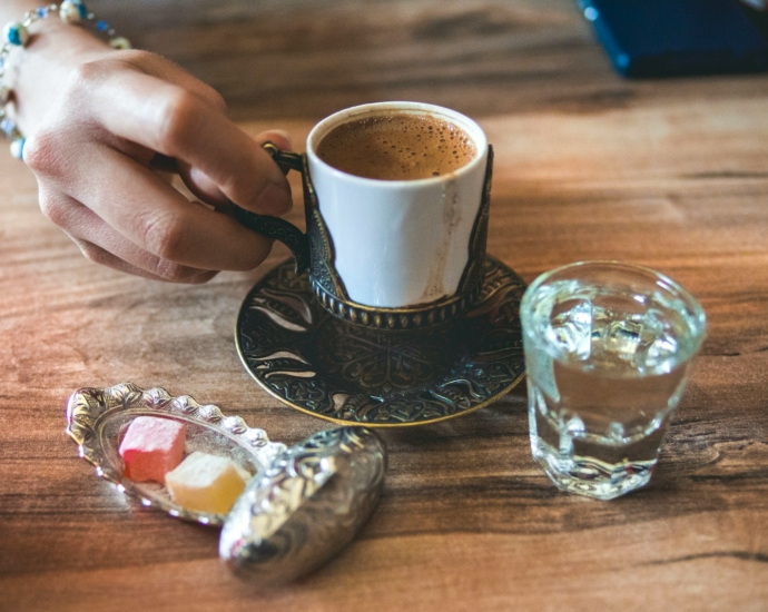 white ceramic cup near mug