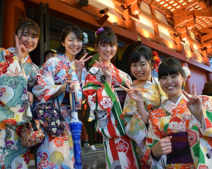 five women wearing oriental dresses